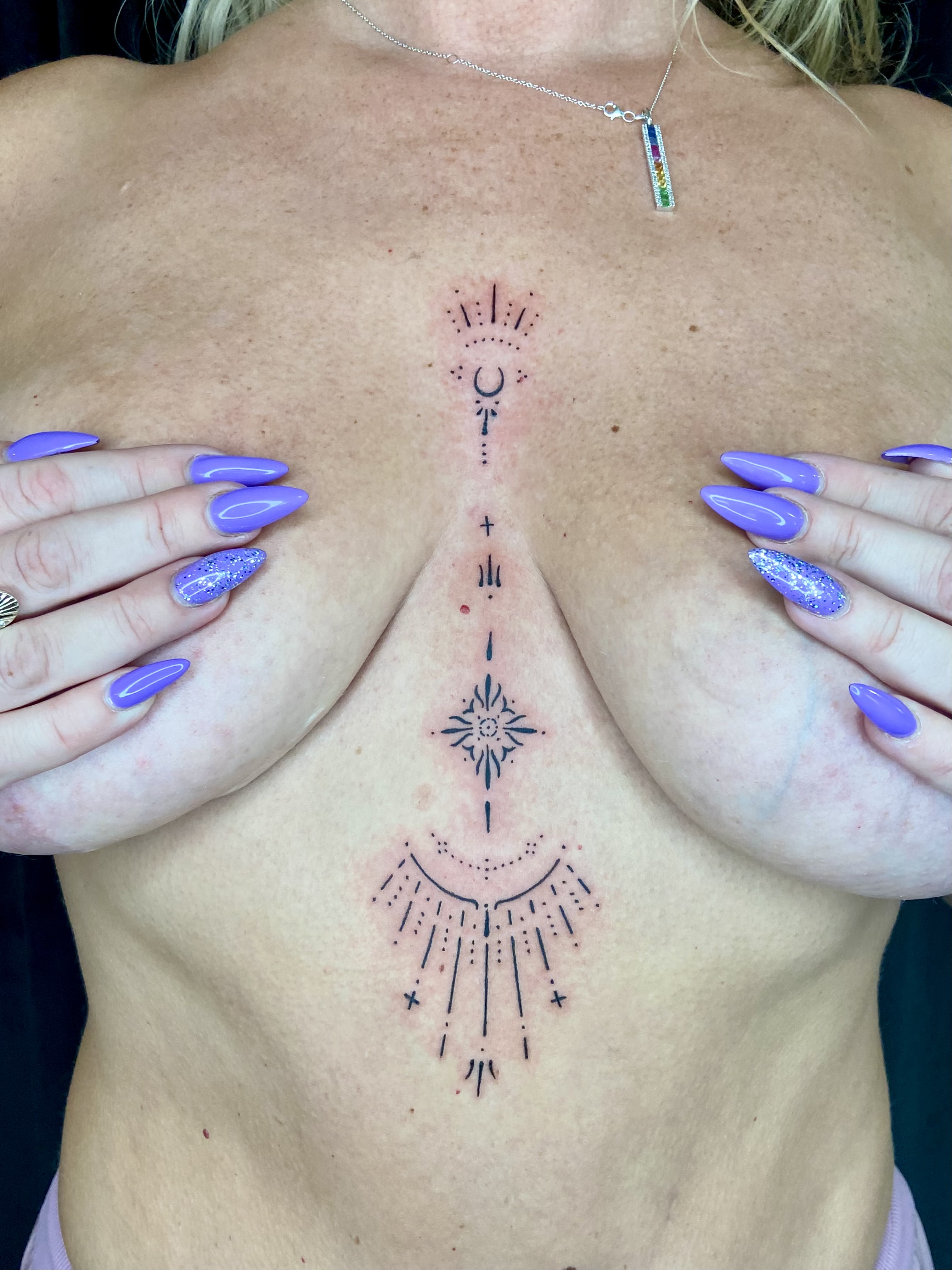 Ornamental sternum tattoo gallery cover by Embodiment of Ink